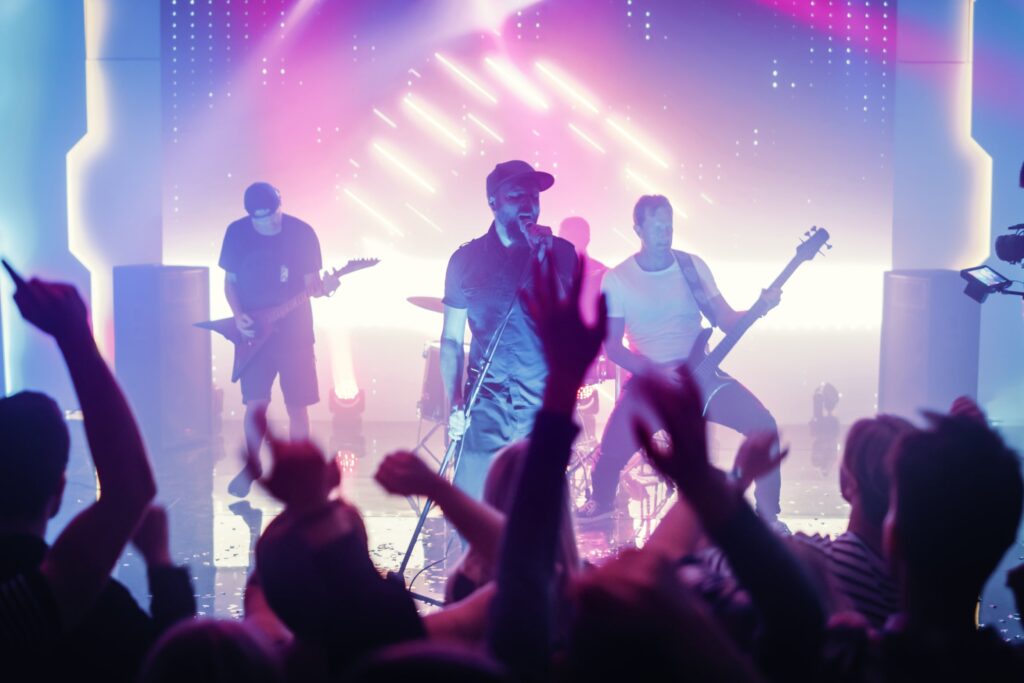 concert venue with a singer and band