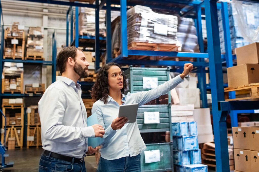 managers showing off products in a warehouse