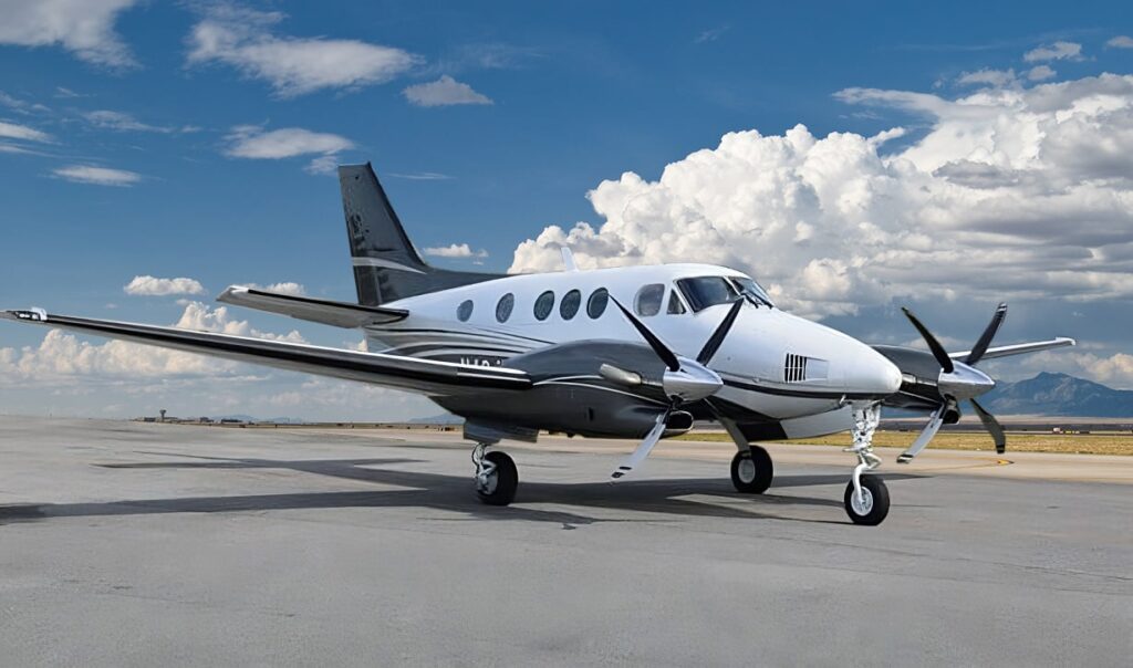 exterior shot of a private jet outside on a sunny day on an empty tarmac
