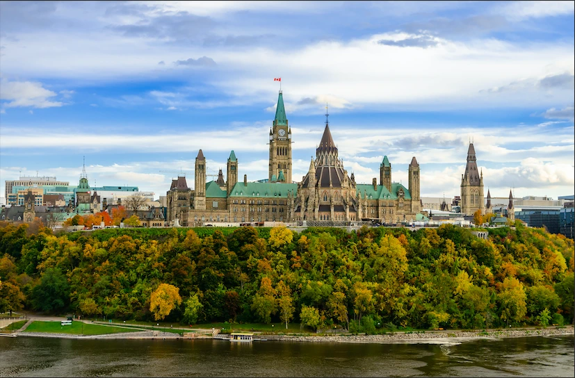 Autumn view of Parliament Hill and Ottawa River in Ottawa, Canada