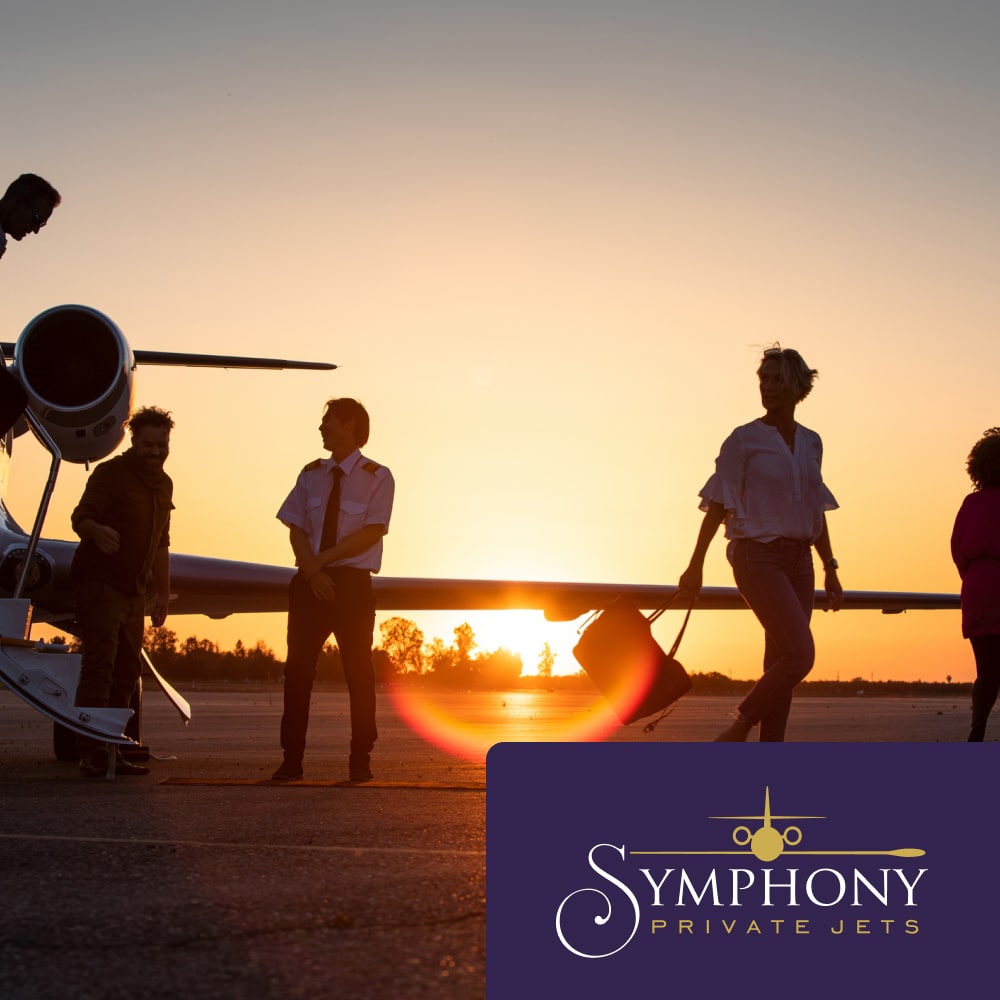 People exiting a private jet during sunset with the Symphony Private Jets logo laid on top in the corner