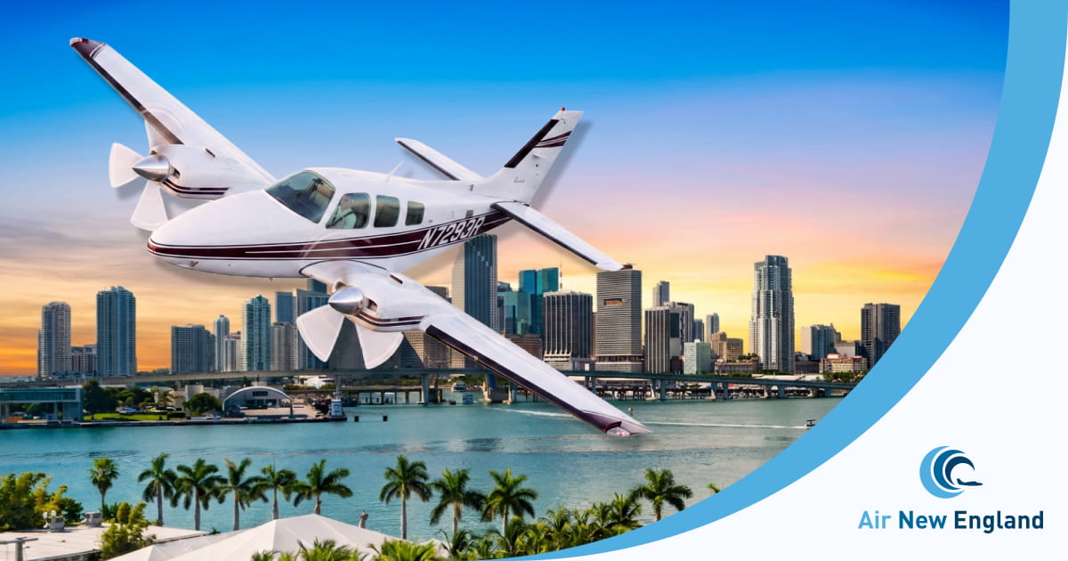 beechcraft baron flying in florida sunset with air new england private charter